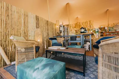 a room with a tent with a couch and a table at Kruger Untamed - Satara Plains Camp in Die Brug