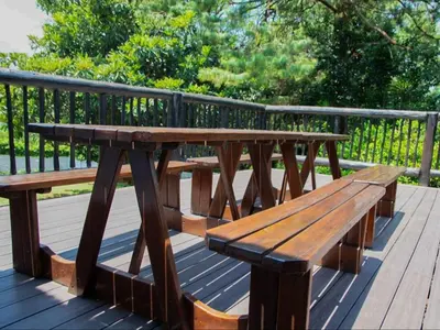 a wooden picnic table sitting on a wooden deck at Boven Villa in Waterval Boven
