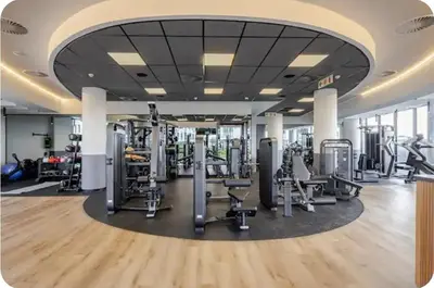 a gym with treadmills and exercise equipment in a building at Cosy Ellipse 2012 Waterfall Midrand in Midrand