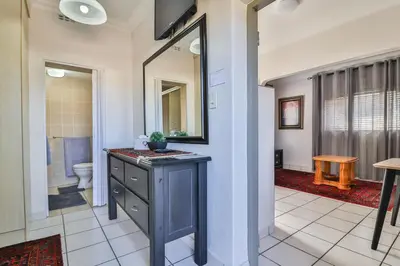 a bathroom with a sink and a toilet at Cascade Villa Guesthouse in Secunda