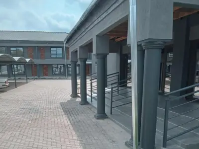 a row of columns on the side of a building at Giyani Shamba Lodge in Giyani