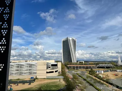 a view of a building with a tall building at Entire Apartment in Waterfall, South Africa in Midrand