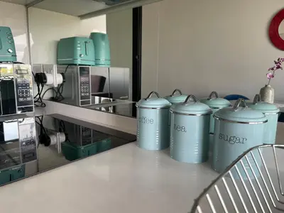 a row of trash cans on a counter in a kitchen at Entire Apartment in Waterfall, South Africa in Midrand