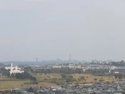 a view of a city with buildings in the distance at Entire Apartment in Waterfall, South Africa in Midrand