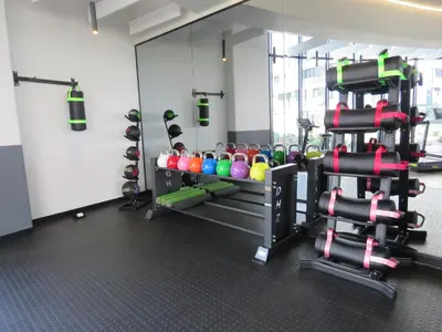 a gym with a bunch of balls and weights at Entire Apartment in Waterfall, South Africa in Midrand
