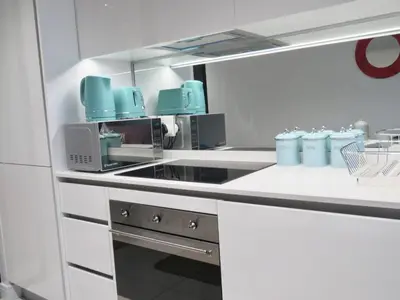 a kitchen with blue bottles on a counter at Entire Apartment in Waterfall, South Africa in Midrand