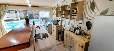 a kitchen with a sink and a counter top at Joy Haven - Open Plan Studio in Centurion