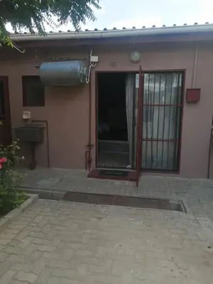 an outside view of a house with a window at Walalawasala in Polokwane