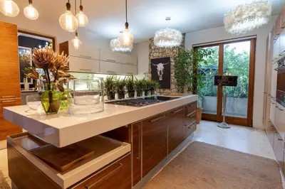 a kitchen with a island with a counter top at Glenferness AH Villa in Midrand