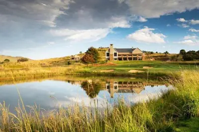 a house on a golf course with a pond at Bald Ibis (856 Highland Gate) in Dullstroom