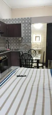 a kitchen with a table and chairs in a room at Whitehouse Lodge Benoni in Benoni