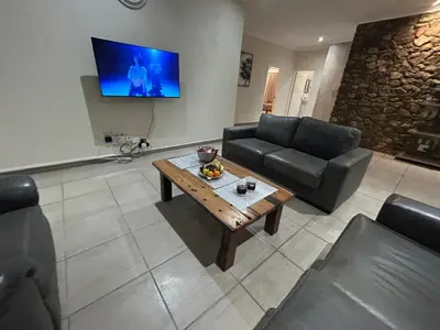 a living room with a couch and a coffee table at Melamar Estate in Marloth Park