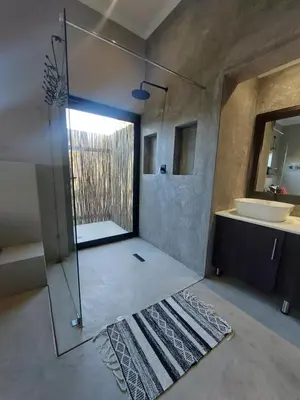 a bathroom being remodeled with a shower and a sink at House UmGanu in Marloth Park