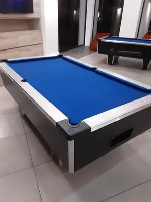 a pool table with blue top in a room at The Blydes Pretoria in Pretoria