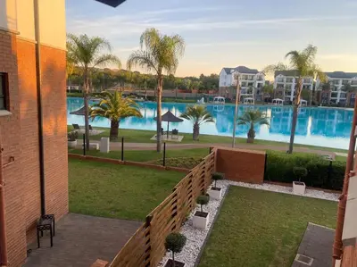 a view of a swimming pool from a building at The Blydes Pretoria in Pretoria