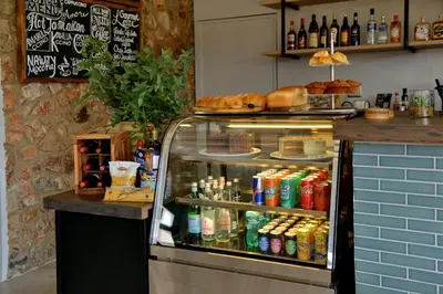 a bakery with a display case with food and drinks at Thanda Manzi Country Hotel in Centurion