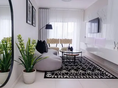 a living room with a couch and a table at Luminant Escapes - with power backup in Midrand