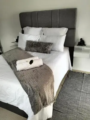 a bed with two pillows on top of it at 20 on Middle in Polokwane