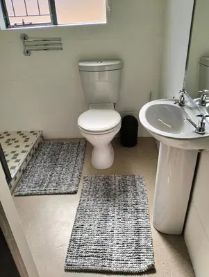 a bathroom with a toilet and a sink at 20 on Middle in Polokwane