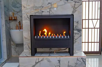 a fireplace in a bathroom with a sink at Homes of Ace Studio 1 in Pretoria