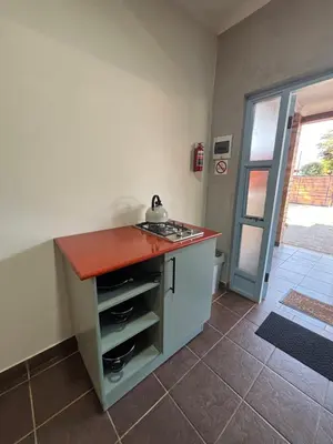 a kitchen with a counter with a sink in it at 59 van Heerden in Mokopane