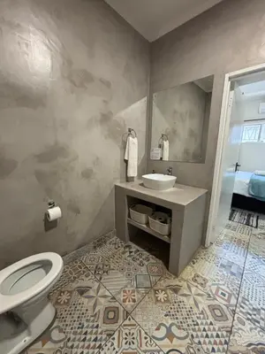 a bathroom with a toilet and a sink in it at 59 van Heerden in Mokopane