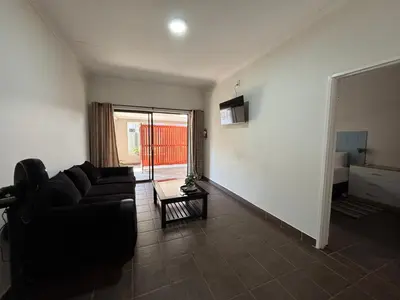 a living room with a couch and a table at 59 van Heerden in Mokopane