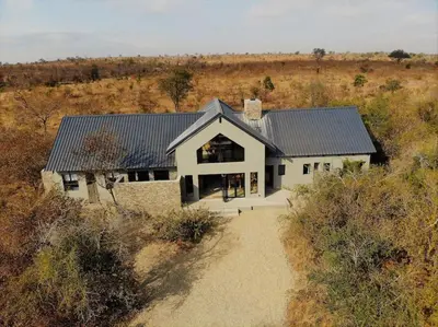 an aerial view of a house in a field at Ebony House - Kruger National Park in Hectorspruit