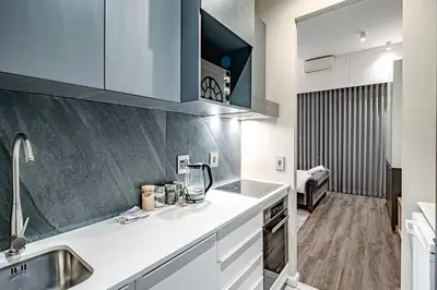 a kitchen with a sink and a counter top at Penthouse and Apartment at The Capital Triology Menlyn Maine in Pretoria