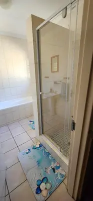 a shower with a glass door in a bathroom at 20 Pendleberry Holiday Resort in Bela-Bela