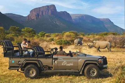 a group of people riding in a safari vehicle at Marataba Safari Lodge in Hartbeestfontein