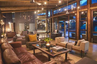 a large living room with couches and a table at Marataba Safari Lodge in Hartbeestfontein