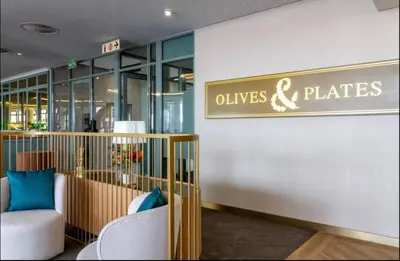 a store with chairs and a sign on a wall at Ellipse Cassini @ Waterfall (Fili) in Midrand