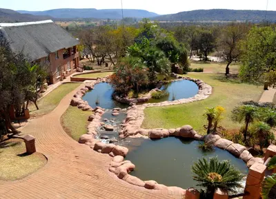 an aerial view of a garden with two ponds at Zebra Nature Reserve in Cullinan