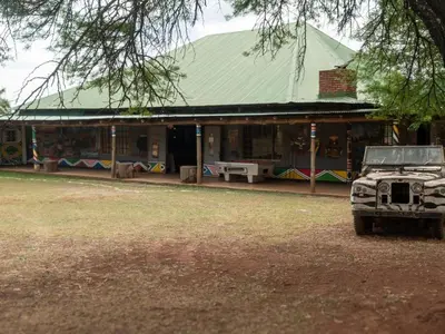 a truck parked in front of a building at Zebra Nature Reserve in Cullinan