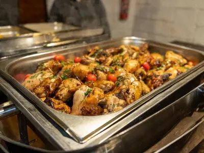 a metal pan filled with food in a kitchen at Zebra Nature Reserve in Cullinan