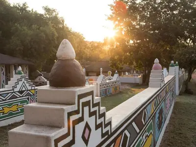 a fence with a statue on top of it at Zebra Nature Reserve in Cullinan