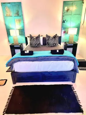 a bedroom with a large bed with two pillows at Luxury GuesthouseCo RomanticaHouse in Marloth Park