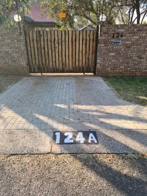a street with a sign that says on the ground at Hornbill Helipad 2 in Centurion