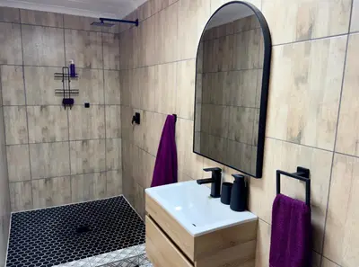 a bathroom with a sink and a mirror at Sugar Plum Rest in Polokwane