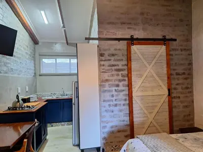 a kitchen with a sliding barn door in a room at 1@Kruger Unit 3 in Mokopane