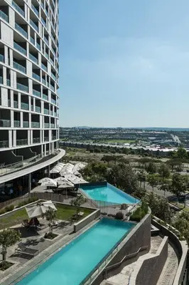 an aerial view of a building with two pools at Elipse Waterfall-2802 in Midrand