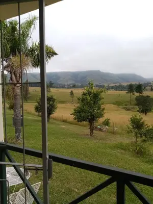a view of a field from a house at Le Paradise holiday resort in Badplaas