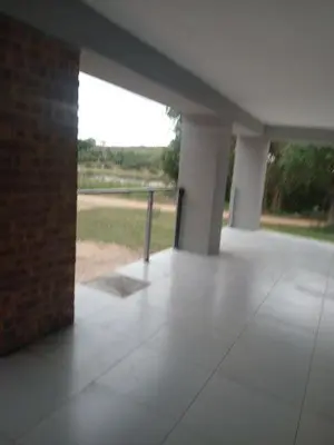an empty building with a view of a field at Tswenyane Kruger Riverview Apartments in Marloth Park