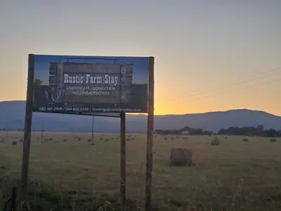 a sign in the middle of a field at Rustic Farm Stay in Lydenburg