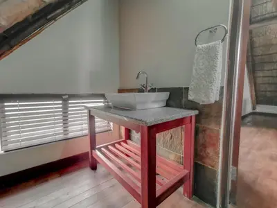 a bathroom with a sink on top of a table at Sunshine Retreat @ Zebula in Mabula