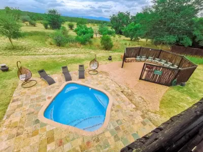 an overhead view of a swimming pool in a yard at Sunshine Retreat @ Zebula in Mabula