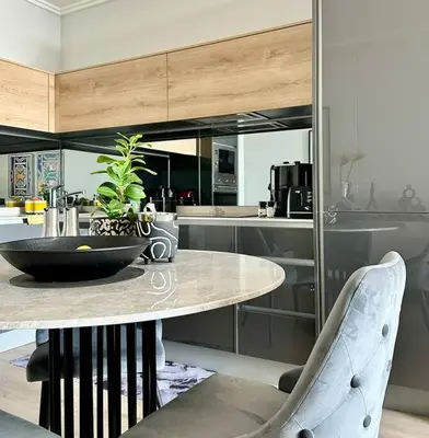 a kitchen with a table with a plant on it at Explore Ellipse - Nguni Room in Midrand