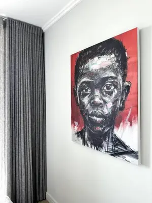 a painting of a black man hanging on a wall at Explore Ellipse - Nguni Room in Midrand