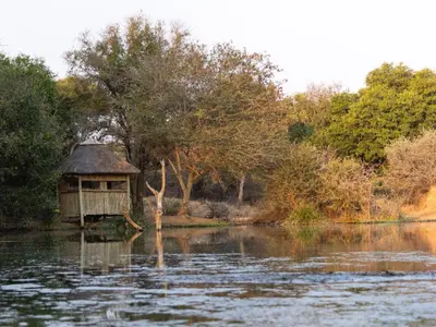 a small house in the middle of a lake at Afrikaya Villas in Hoedspruit